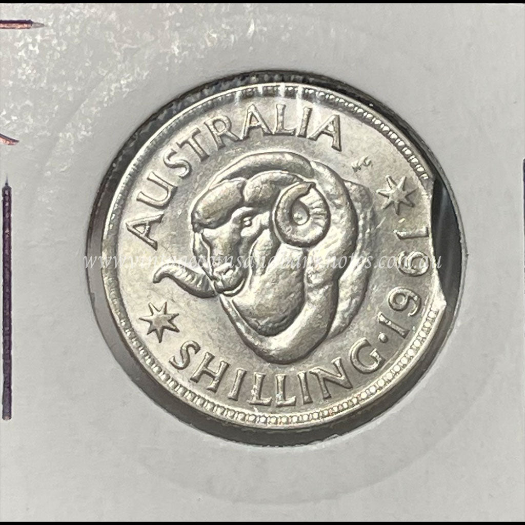 1961 Australian Shilling Error Clipped Edge GEM